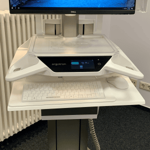 A white Man & Machine washable Its Cool keyboard covered by a transparent Clear Drape and a white washable C Mouse are seen on a medical cart A white Man & Machine washable Its Cool keyboard covered by a transparent Clear Drape and a white washable C Mouse are seen on a medical cart