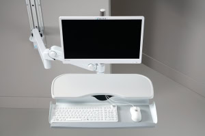 A white Man & Machine fully sealed Really Cool keyboard and Petite Mouse are seen on a wall mount tray. A white Man & Machine fully sealed Really Cool keyboard and Petite Mouse are seen on a wall mount tray.